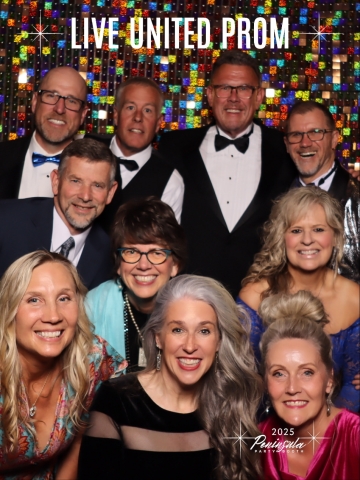 smiling people in a photo booth