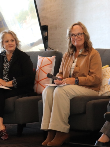Two women on a stage in comfy stairs