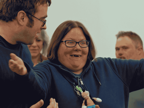 a man and woman doing physical exercise