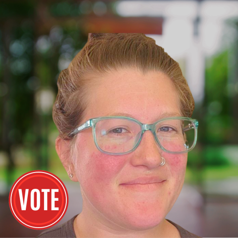 woman with red hair tied back