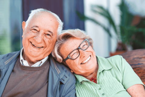 two smiling elderly people
