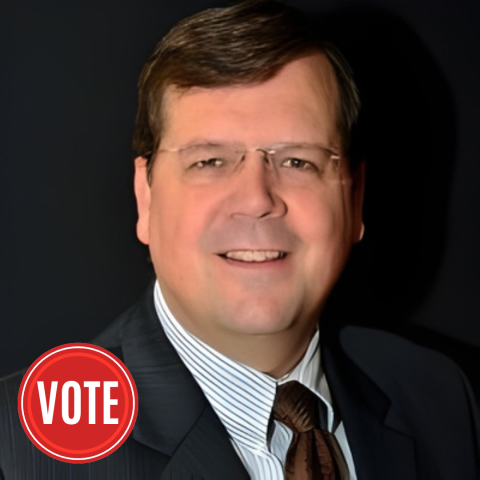 headshot of a man in a suit