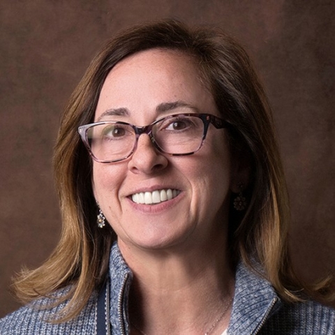 headshot of a woman in glasses