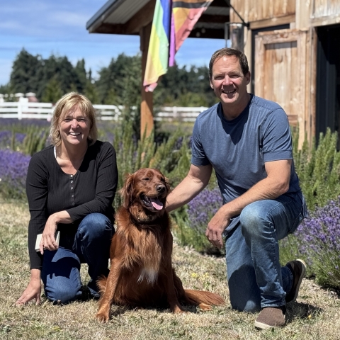 Smiling couple with dog