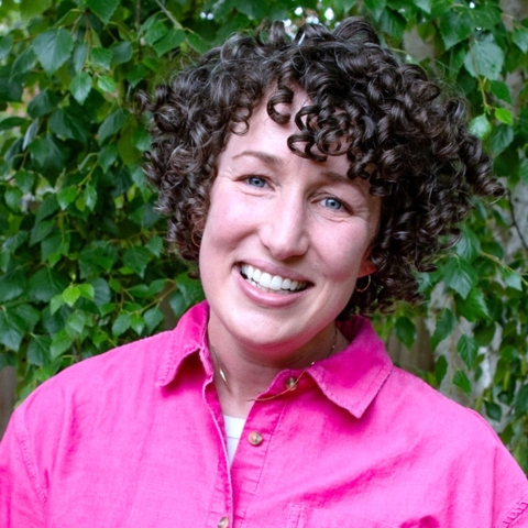 headshot of woman with curly  hair