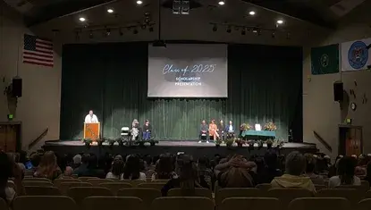 A darkened auditorium during an awards presentation